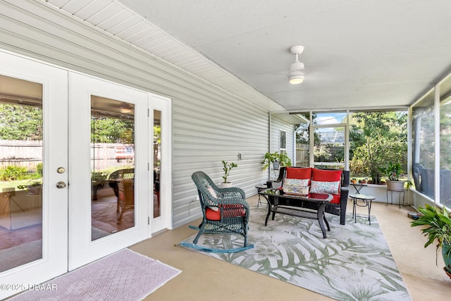 sunroom / solarium with a wealth of natural light and french doors