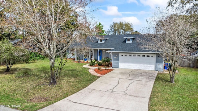 traditional-style home with a garage, a front yard, concrete driveway, and covered porch