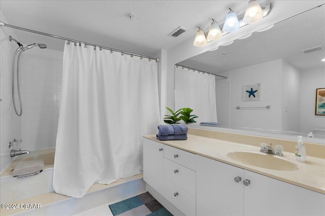 bathroom with tile patterned flooring, vanity, and shower / bath combination with curtain