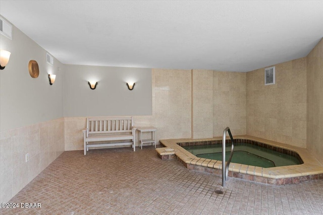 view of pool with an indoor in ground hot tub