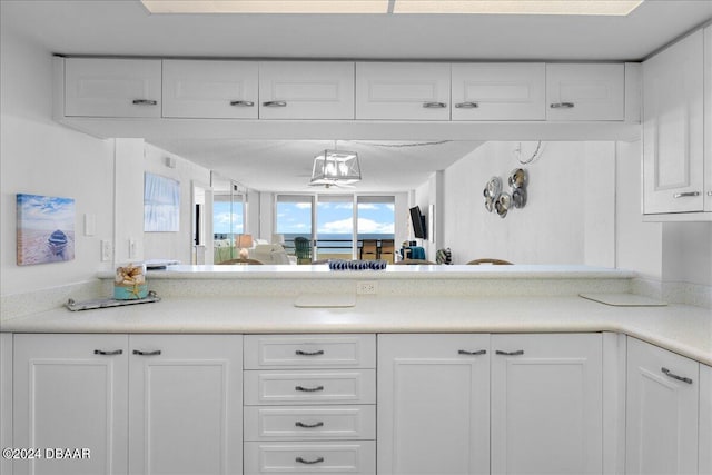 kitchen featuring white cabinets