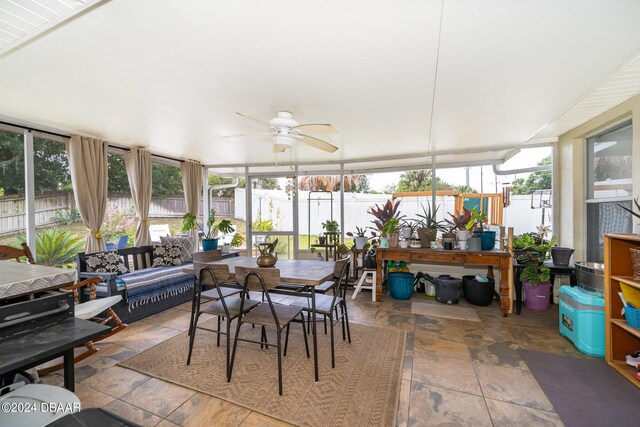 sunroom / solarium featuring ceiling fan and a healthy amount of sunlight