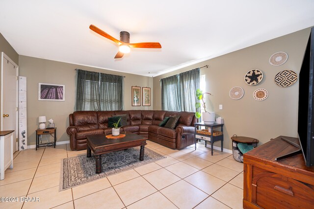 living room with light tile patterned flooring and ceiling fan