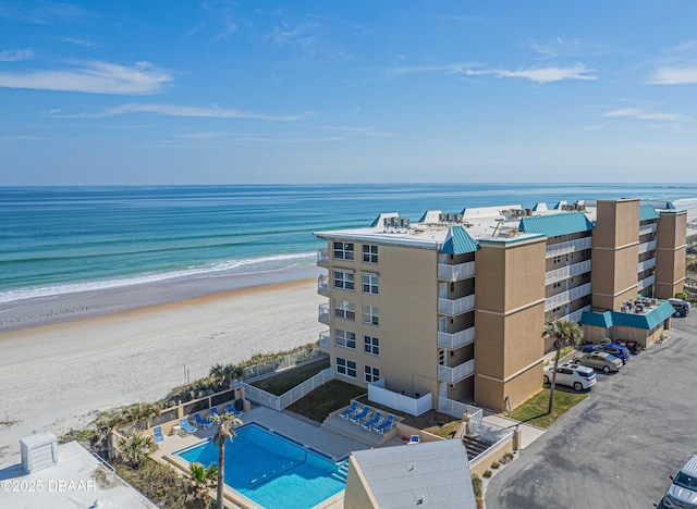 aerial view with a beach view and a water view