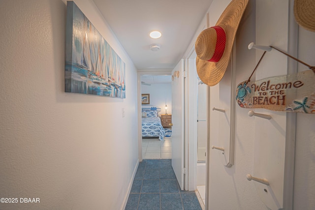 corridor with dark tile patterned floors