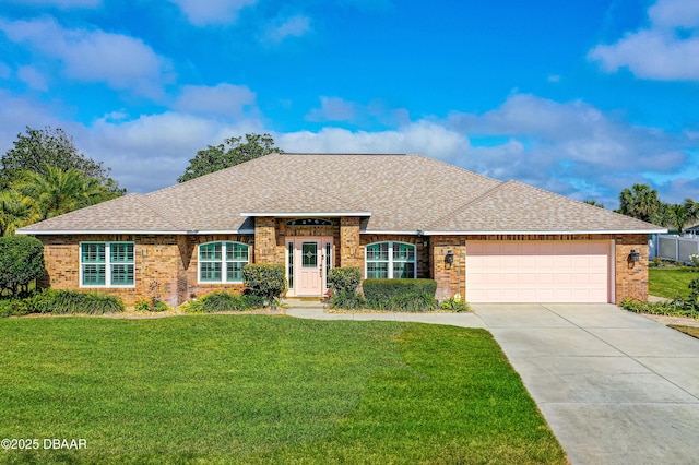 ranch-style home with a garage and a front yard