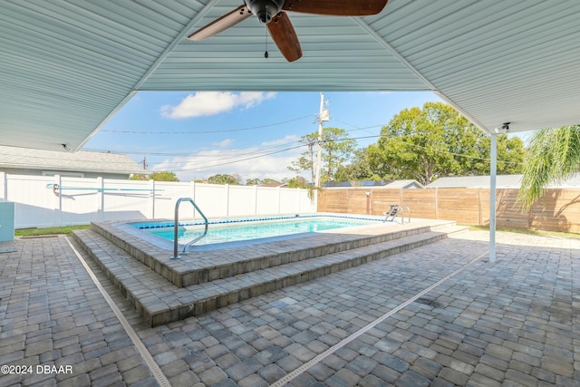 view of pool with ceiling fan and a patio area