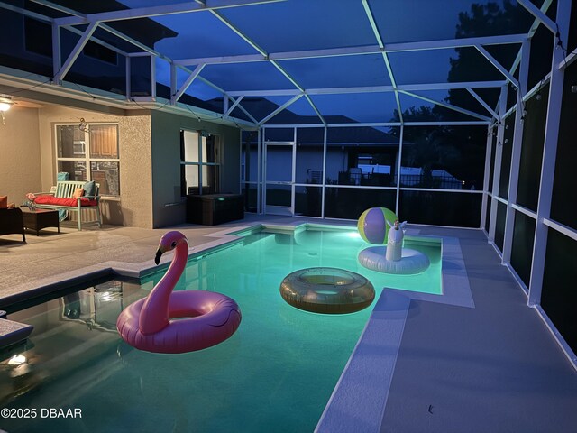 61 Levee Ln, Ormond Beach, FL 32174 - swimming pool with a patio area and glass enclosure