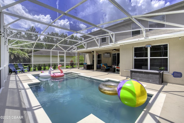 61 Levee Ln, Ormond Beach, FL 32174 - swimming pool featuring a patio area, an outdoor hangout area, ceiling fan, and glass enclosure