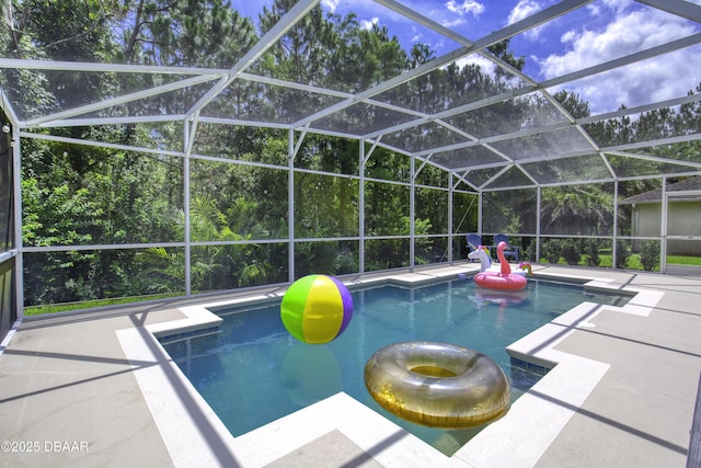 61 Levee Ln, Ormond Beach, FL 32174 - swimming pool with a patio area and glass enclosure