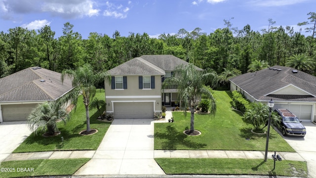 61 Levee Ln, Ormond Beach, FL 32174 - view of front of property with stucco siding, driveway, a front yard, and a garage