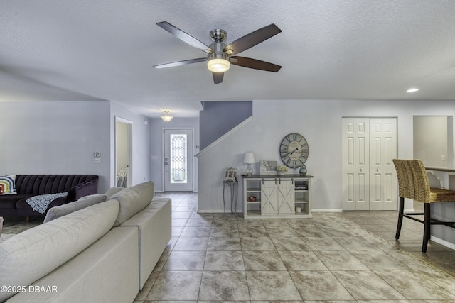 61 Levee Ln, Ormond Beach, FL 32174 - tiled living area with ceiling fan and a textured ceiling