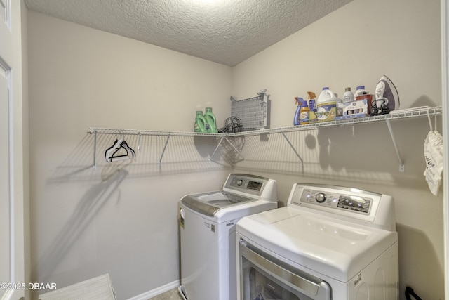 61 Levee Ln, Ormond Beach, FL 32174 - laundry room with separate washer and dryer and a textured ceiling