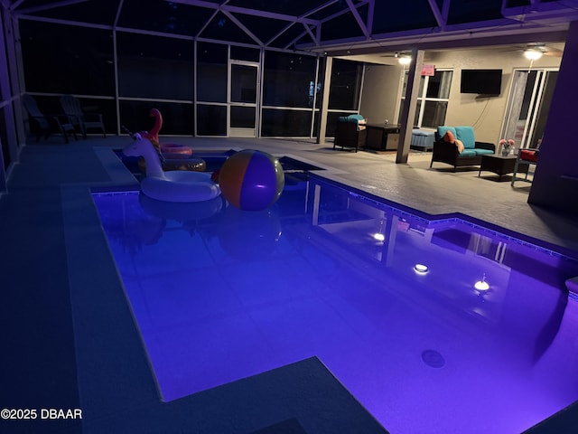 61 Levee Ln, Ormond Beach, FL 32174 - outdoor pool featuring a patio and glass enclosure