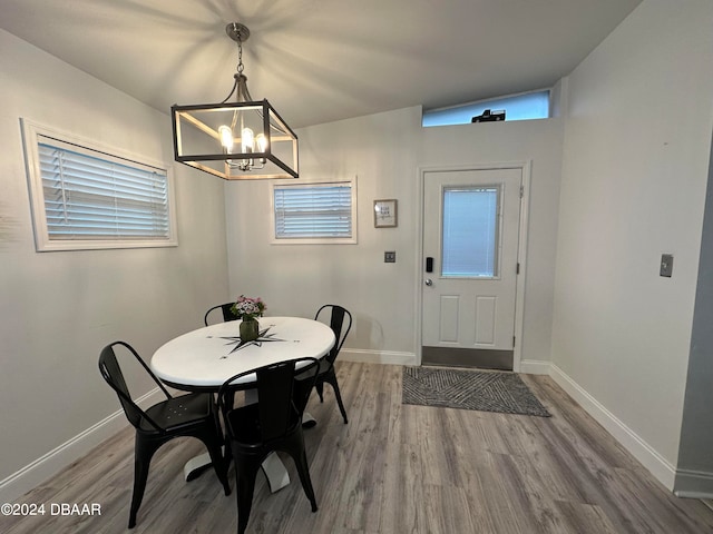 dining room featuring a chandelier and wood-type flooring