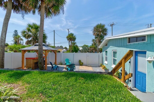 view of yard featuring a gazebo and a patio