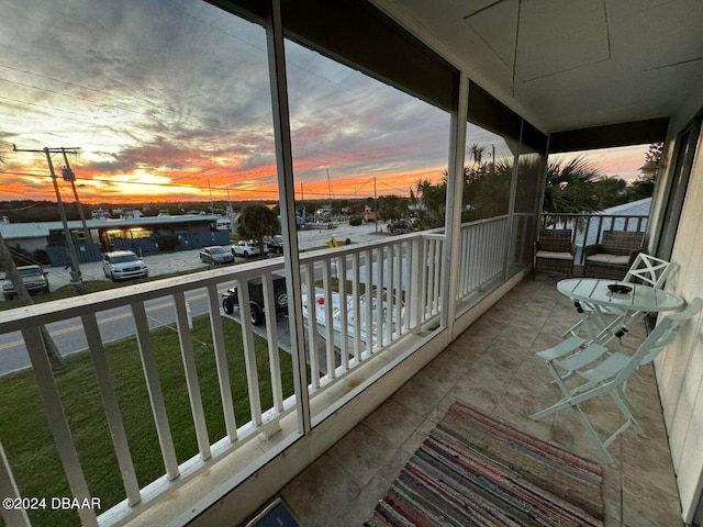 view of balcony at dusk