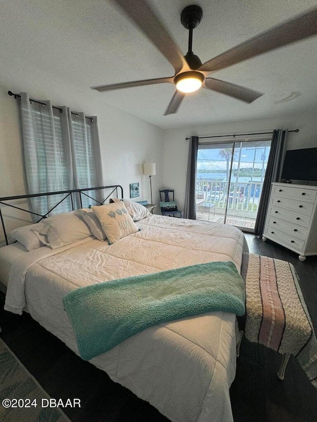 bedroom with access to exterior, ceiling fan, and dark hardwood / wood-style flooring