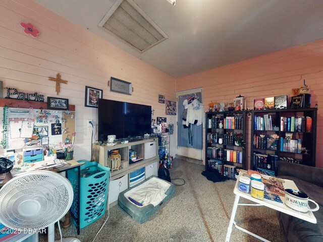 310 Legion Pl, Port Orange, FL 32129 - carpeted living room featuring attic access and wooden walls