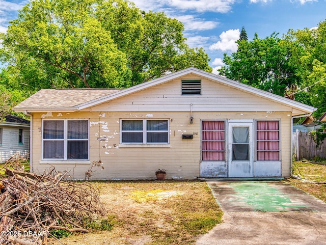310 Legion Pl, Port Orange, FL 32129 - bungalow featuring roof with shingles and fence