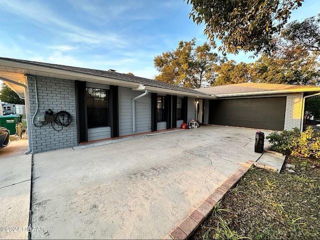 ranch-style home featuring a garage