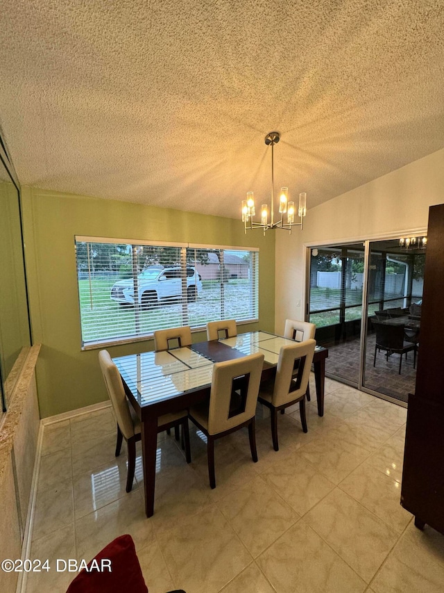 dining space with an inviting chandelier, a textured ceiling, and plenty of natural light