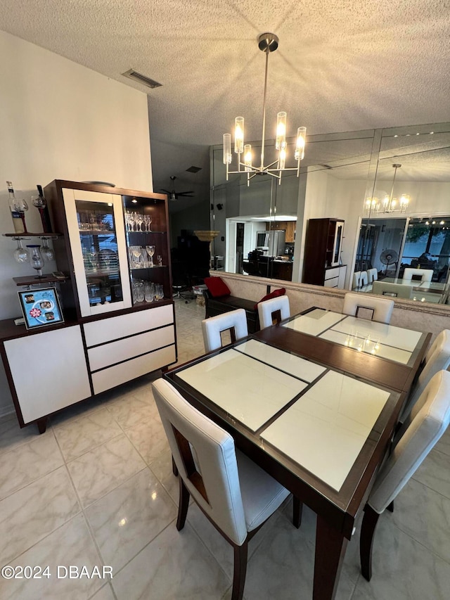 dining space featuring a textured ceiling