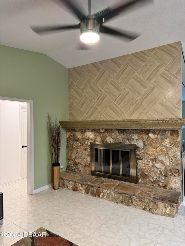 details featuring ceiling fan and a stone fireplace