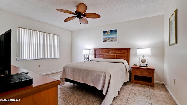 4655 46th Street Ct W Unit 101, Bradenton, FL 34210 - bedroom with light tile patterned flooring, a textured ceiling, and a ceiling fan