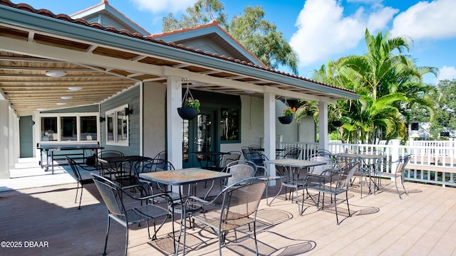 4655 46th Street Ct W Unit 101, Bradenton, FL 34210 - wooden deck featuring outdoor dining area