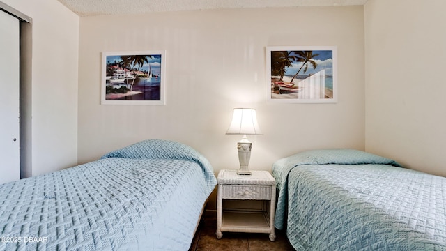 4655 46th Street Ct W Unit 101, Bradenton, FL 34210 - bedroom with dark tile patterned flooring