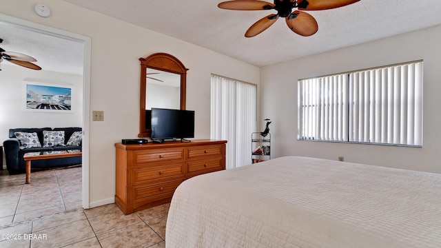 4655 46th Street Ct W Unit 101, Bradenton, FL 34210 - bedroom featuring light tile patterned floors and ceiling fan