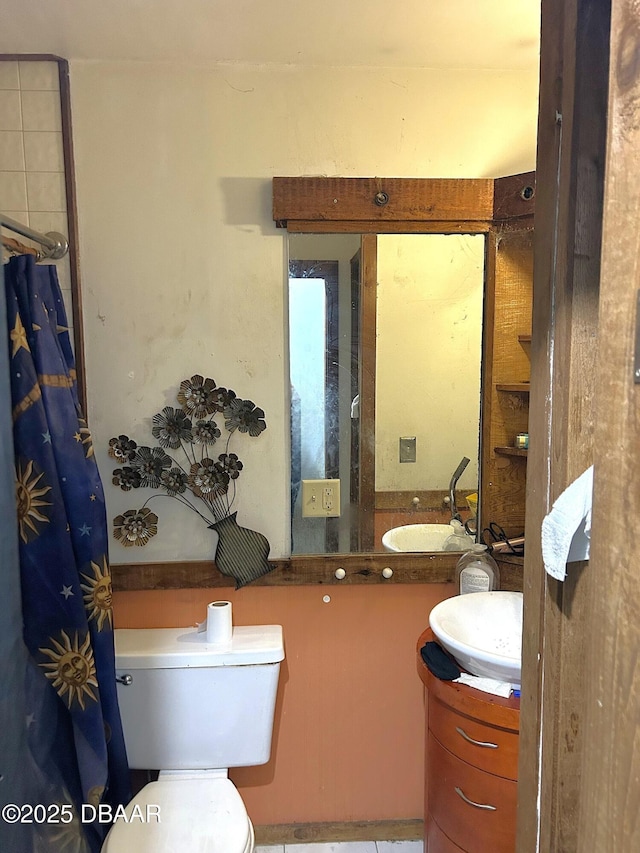 full bath featuring toilet and vanity