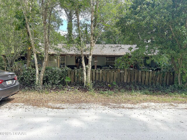 view of front of house with fence