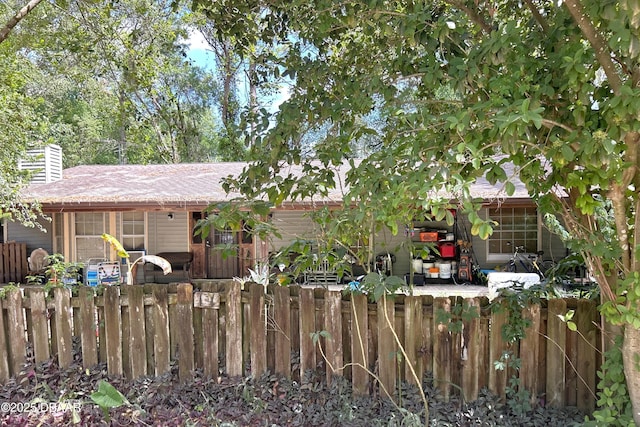 rear view of property featuring fence private yard and a chimney