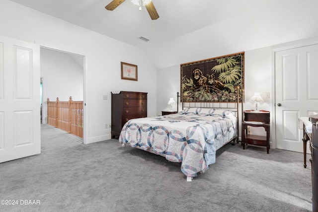 carpeted bedroom featuring vaulted ceiling and ceiling fan