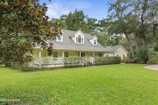 view of front of home featuring covered porch and a front yard