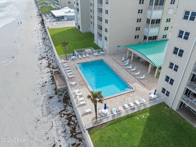 view of swimming pool with a lawn and a patio area