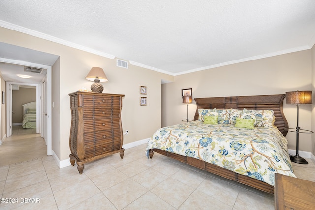 bedroom with a textured ceiling, light tile patterned floors, and ornamental molding