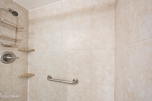 bathroom with a tile shower