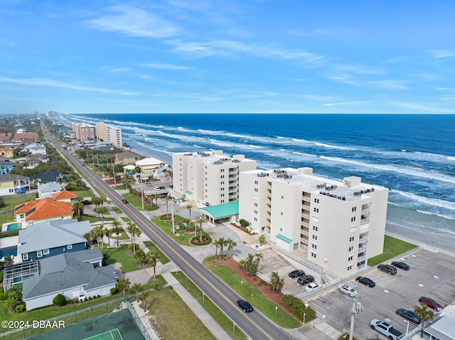 birds eye view of property featuring a view of the beach and a water view