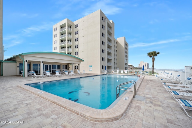 view of swimming pool with a patio