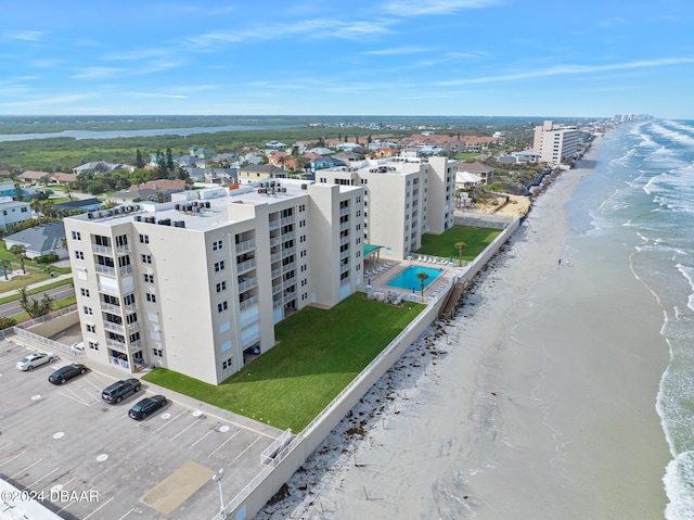 bird's eye view with a beach view and a water view