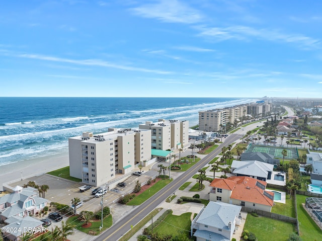 aerial view featuring a view of the beach and a water view