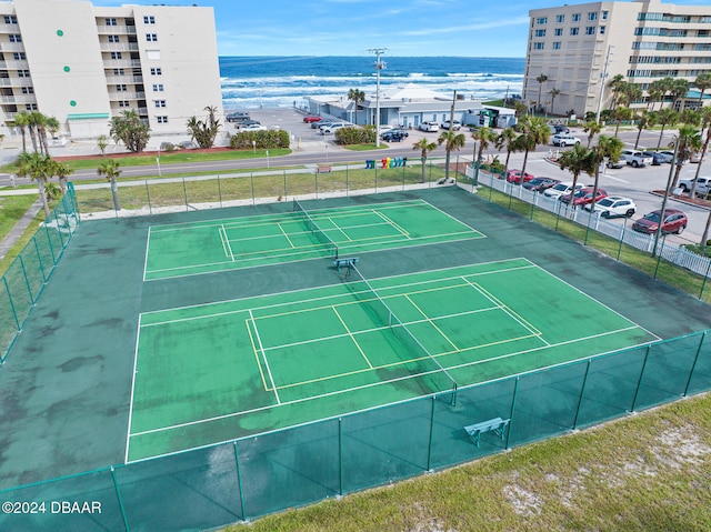 view of sport court featuring a water view