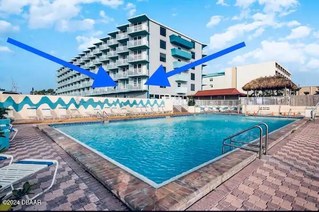 view of swimming pool with a patio area