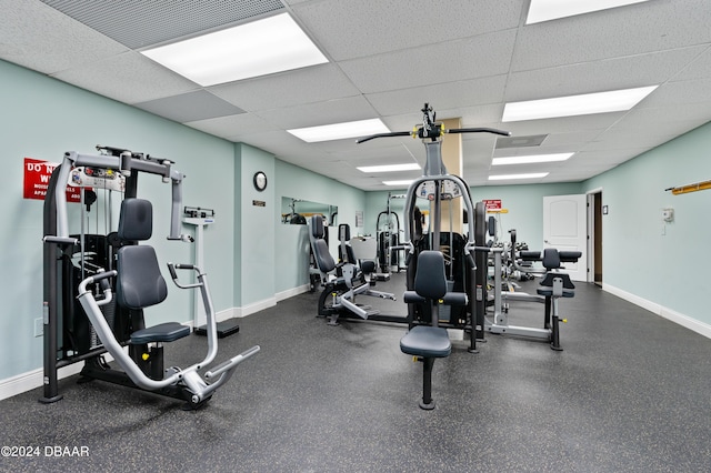 workout area with a paneled ceiling