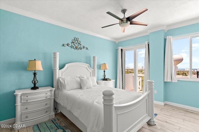 bedroom featuring light hardwood / wood-style flooring, ceiling fan, access to exterior, ornamental molding, and a textured ceiling