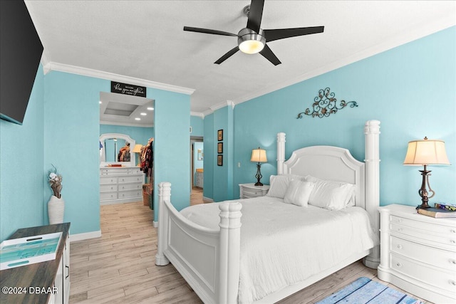 bedroom featuring crown molding, ceiling fan, and light wood-type flooring