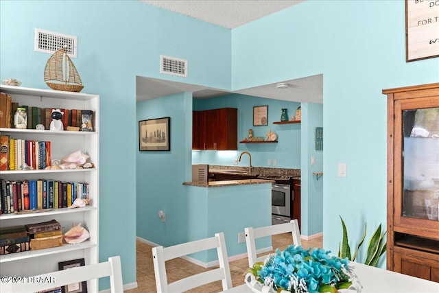 interior space with sink and a textured ceiling